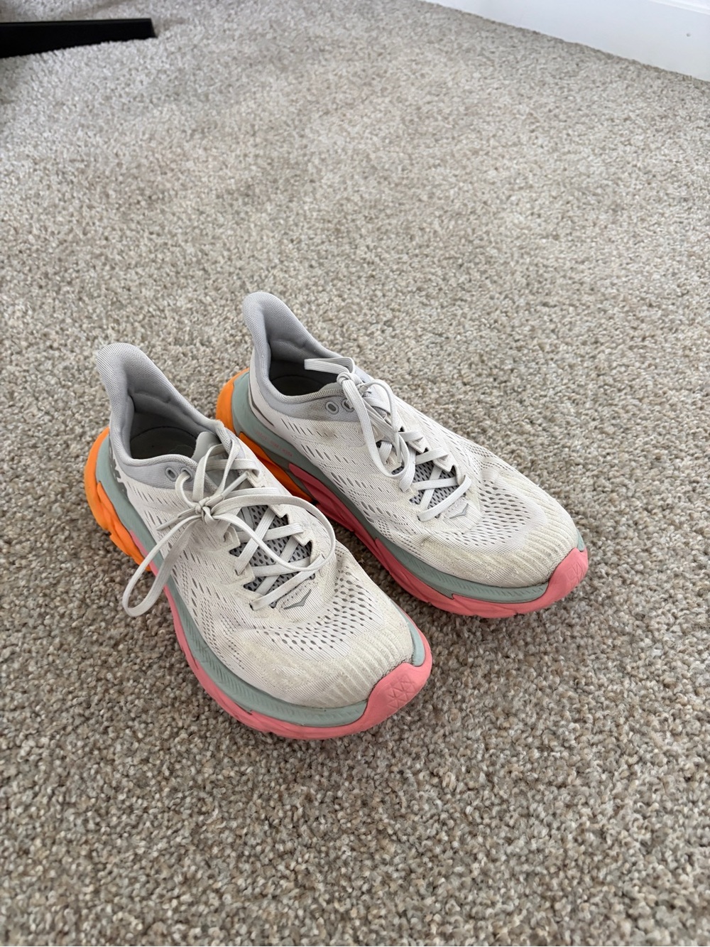 Hoka grey women’s Clifton edge Running Sneakers with Pink and Orange Accents